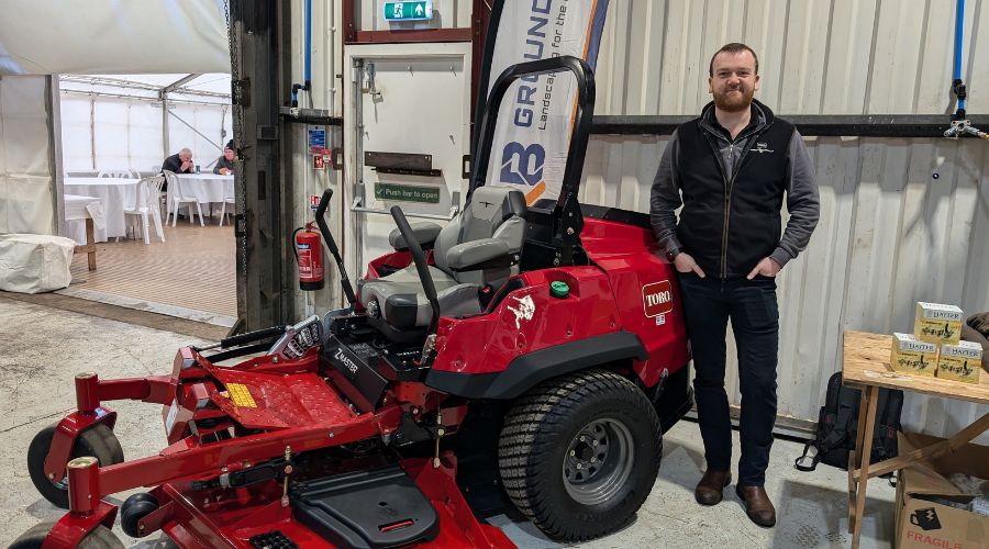 Toro and Hayter’s territory manager Ben Kirkby next to a zero turn mower