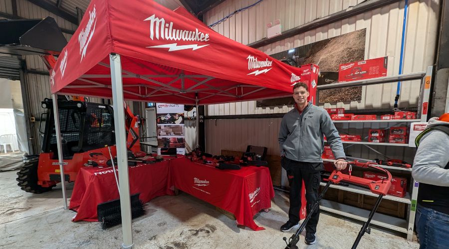 Milwaukee area sales manager Calum Weaver in front of red Milwaukee stand