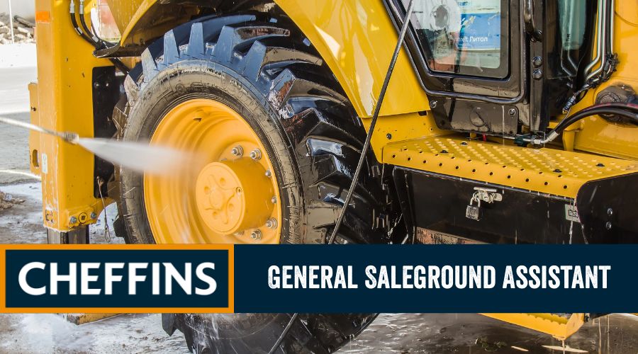 Tractor being power washed